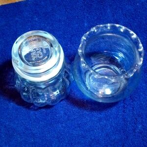 A pair of decorative holders